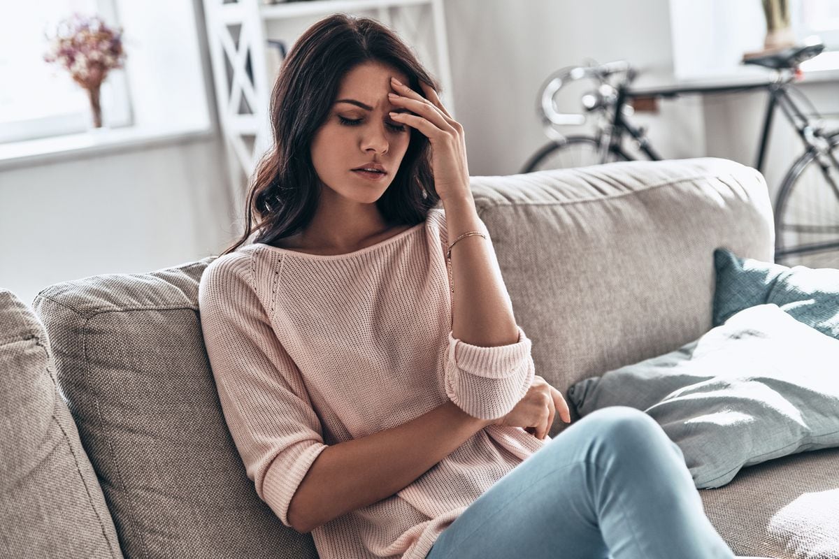 A generic stock photo of a woman feeling stressed.