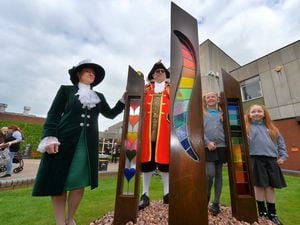 The unveiling of the tribute was attended by Shropshire's High Sheriff Selina Graham, Town Crier Geoff Russell, and Mia Freail and Phoebe Chamberlain from Longlands Primary School.