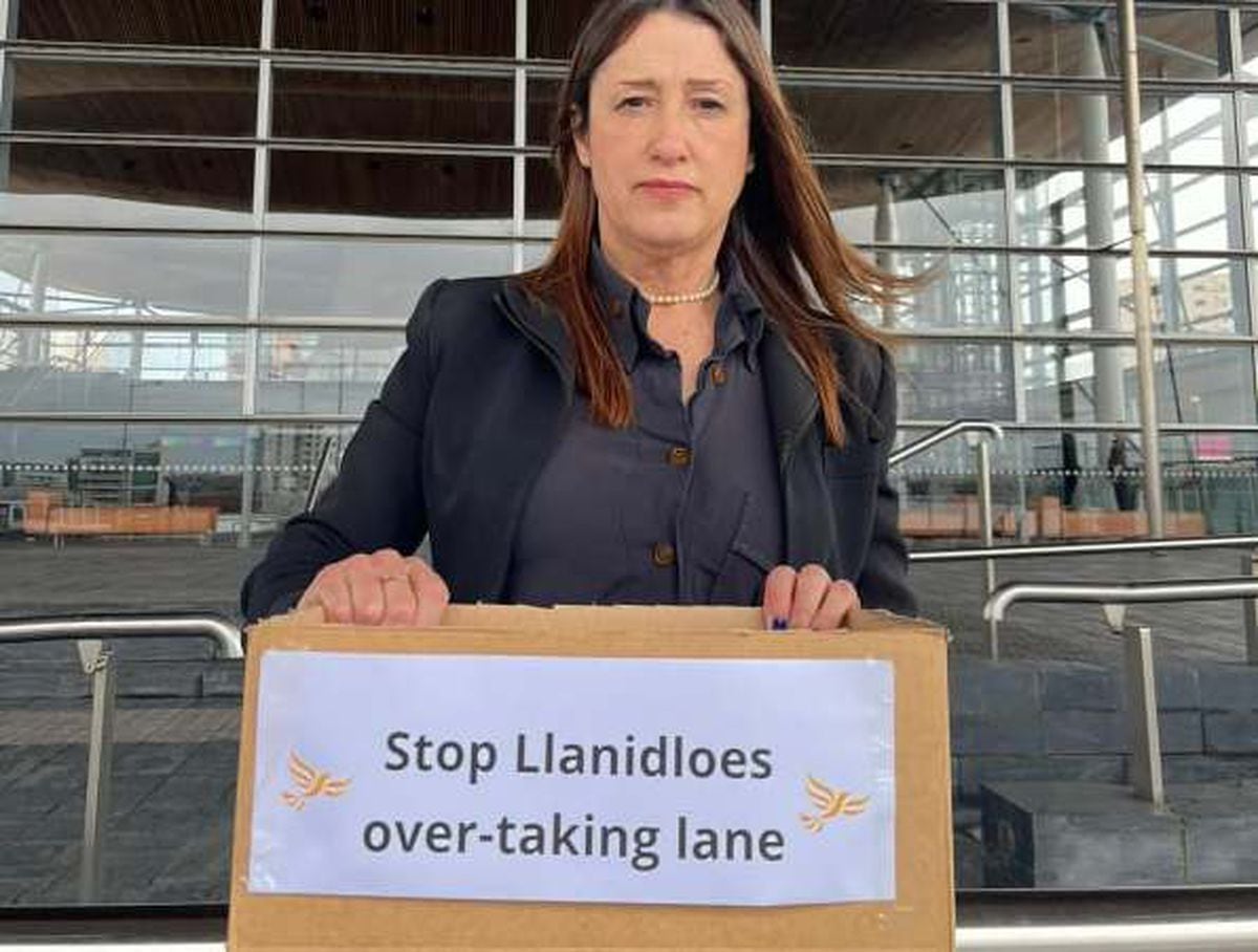 Jane Dodds holding the petition