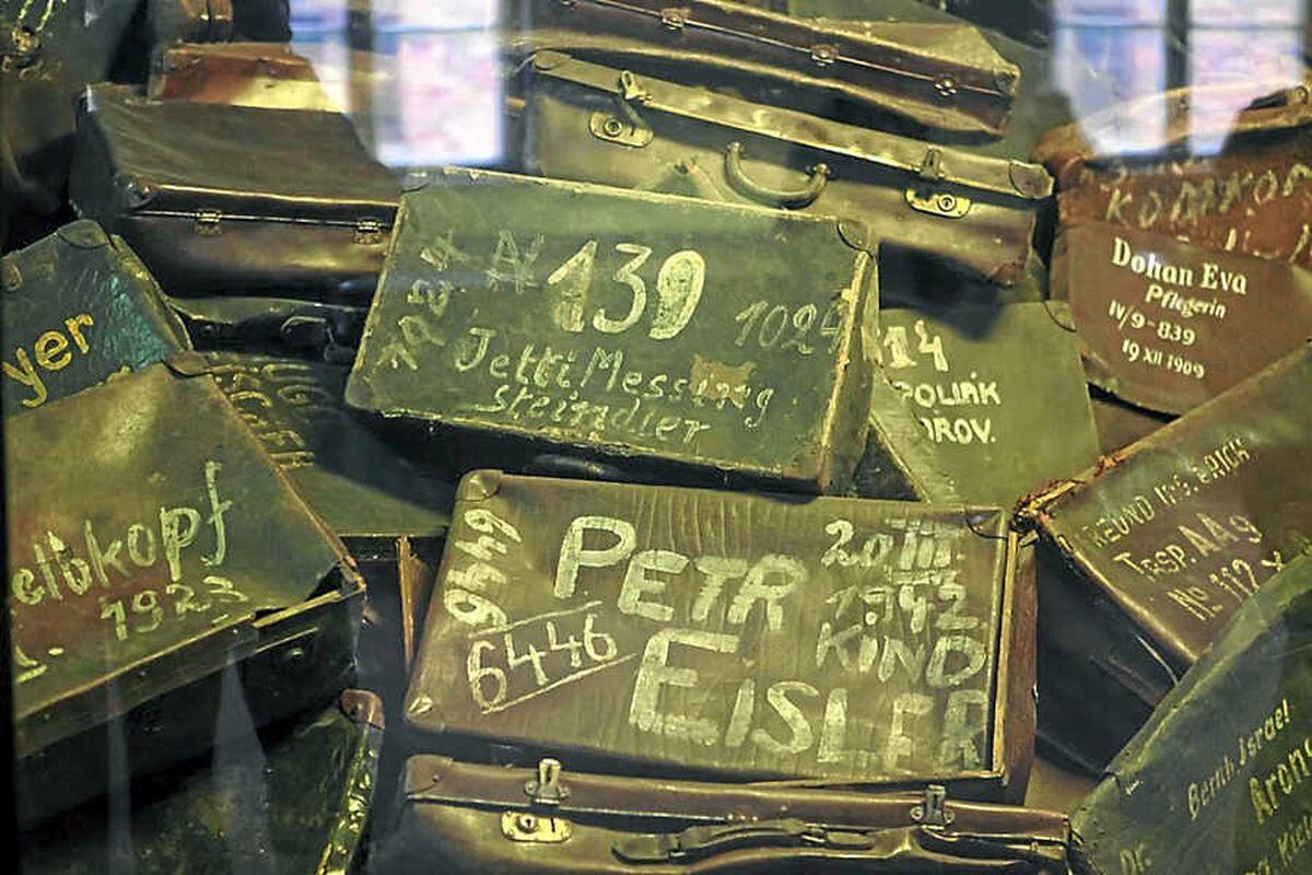 Suitcases marked with the names of their missing owners