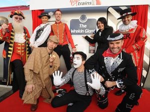 Shropshire Star competition winner Toni Williams, centre, from Telford officially names a Virgin train The Wrekin Giant with a whole host of famous London characters at Shrewsbury Train Station.