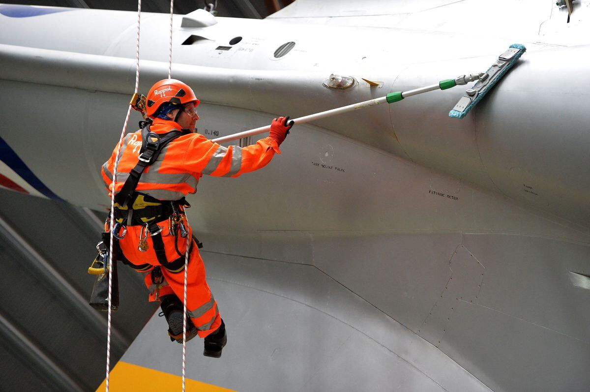 Expert cleaners abseiling down aircraft for the annual spring clean at the RAF Museum’s Cold War Exhibition