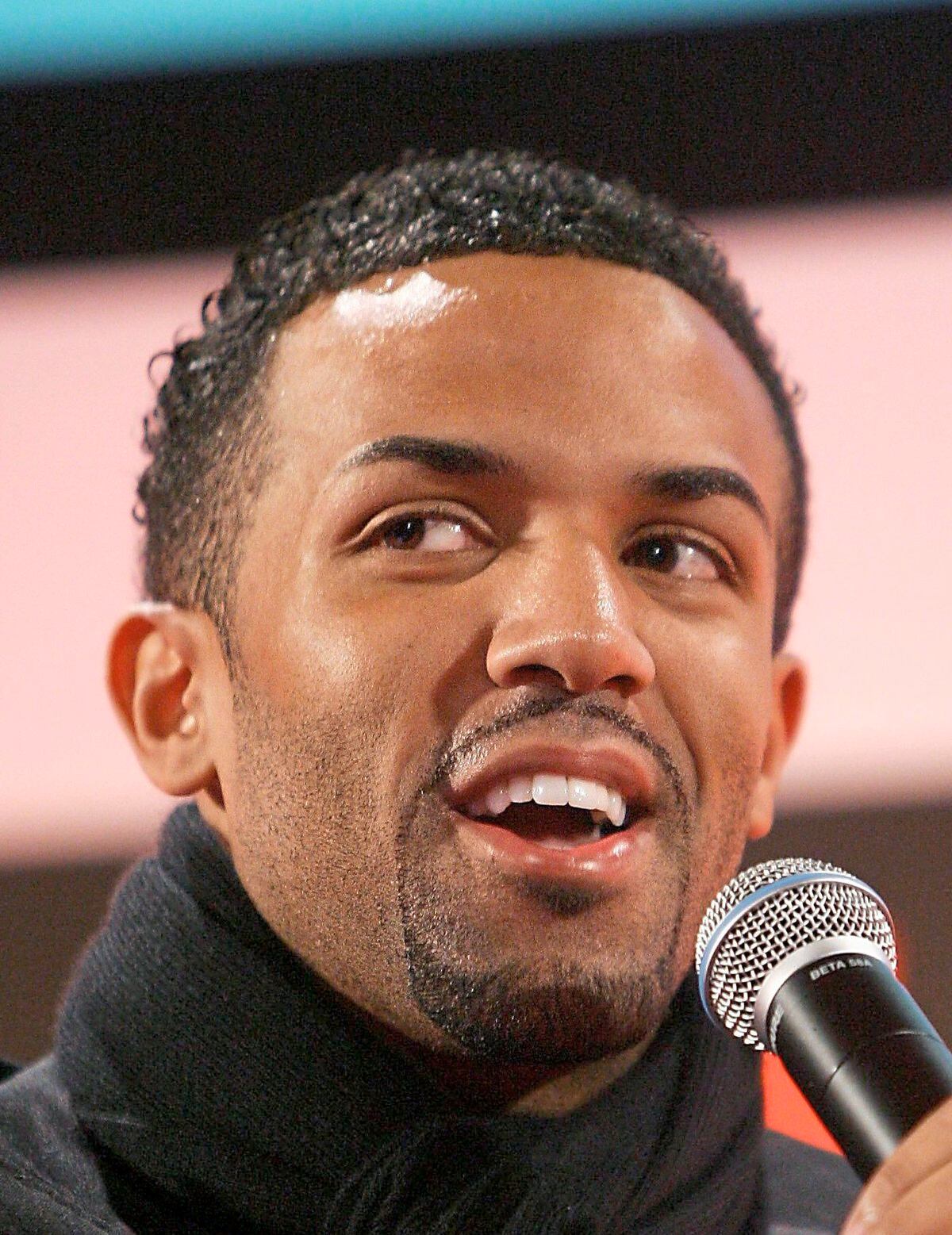 British singer Craig David speaks during a conference at the 3GSM World Congress in Barcelona, Spain February 15, 2006. The world's top handset makers have launched new models at the 3GSM wireless trade show in Barcelona this week, ranging from leading-edge niche products by BenQ Siemens to potential volume sellers from market leader Nokia. The event runs until Thursday. REUTERS/Albert Gea
