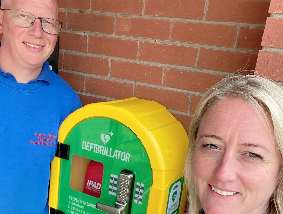 Peter and Clare Booth with the new defibrillator  
