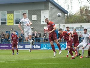 Jordan Piggott (22) (AFC Telford United Defender) gets a head on the ball to direct it towards the net (Pic: Kieren Griffin Photography)