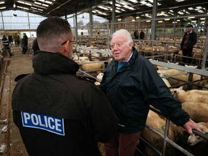 PC Phil Nock speaks with Ivor Davies from Cross Lanes Farm at Oswestry Livestock Market 