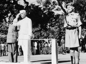 Jawaharlal Nehru salutes the flag as he becomes independent India’s first prime minister on August 15