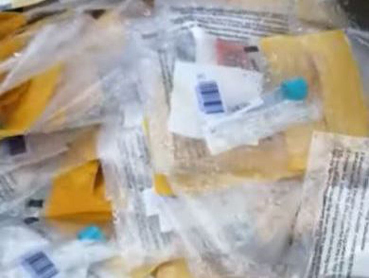 What appear to be PCR kits were left dumped in a carpark. Video: Timothy Draycott