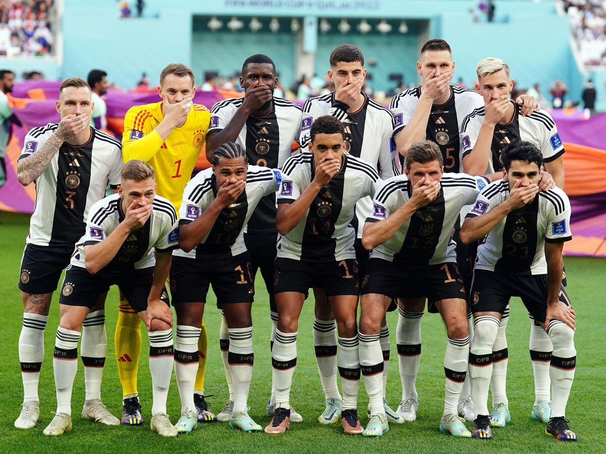 Germany's players cover their mouths in protest at being forced to drop plans to wear an anti-discrimination armband