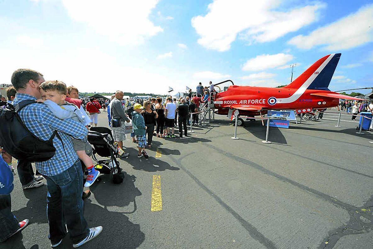 Spectators queue to get a close look at one of the Red Arrows aircraft. The display team were performing at the show.