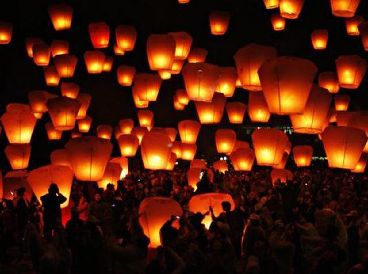 People release sky lanterns to celebrate the traditional Chinese Sky Lantern Festival in Pingsi, Taipei.