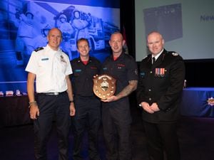 Newport officers collecte the Telent Charity Shield  