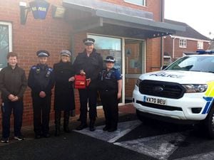 From left with the new defibrillator are, Harry Angell-James, PCSO Andy Hudson, Sally Angell-James, Sgt Rich Jones, and PCSO Krissy Wills.