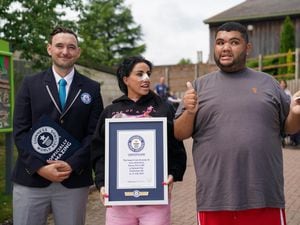 Guinness World Record adjudicator Will Munford, Katie Price and her son Harvey as he is presented with the Guinness World Record for the longest drawing of a train