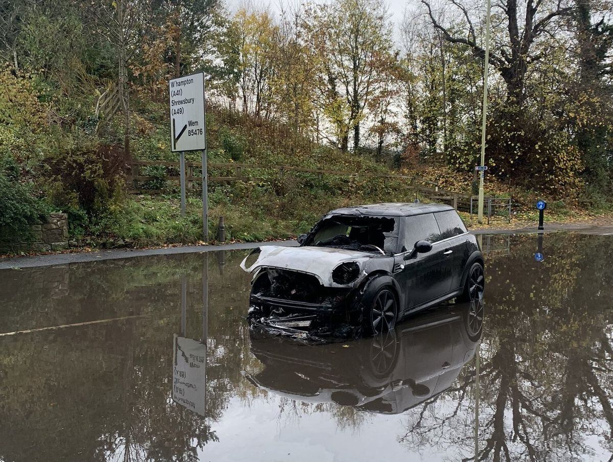 The charred remains of the Mini were left in the road this morning. Photo: North Shropshire's Safer Neighbourhood Team