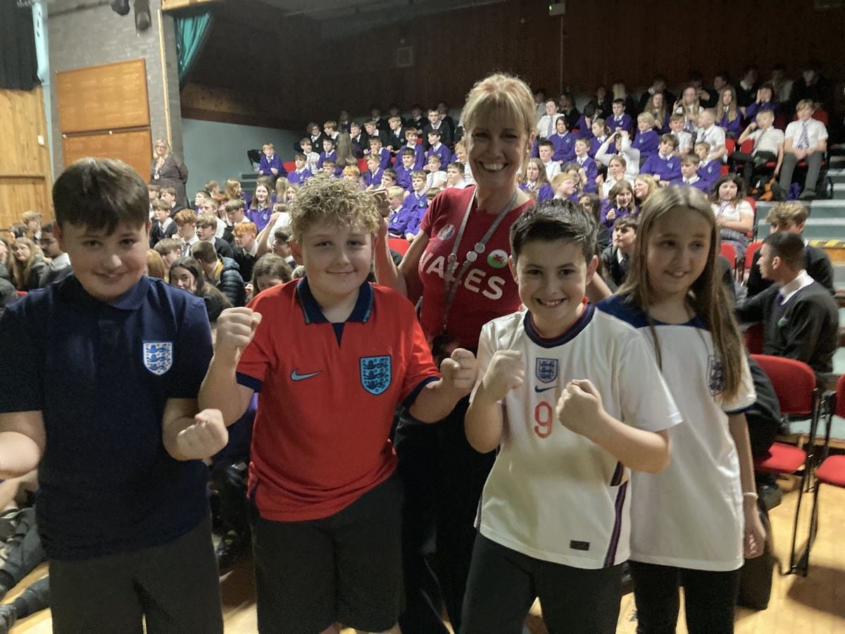 Head at St Martins School, Sue Lovecy, sporting her Wales shirt among England fans