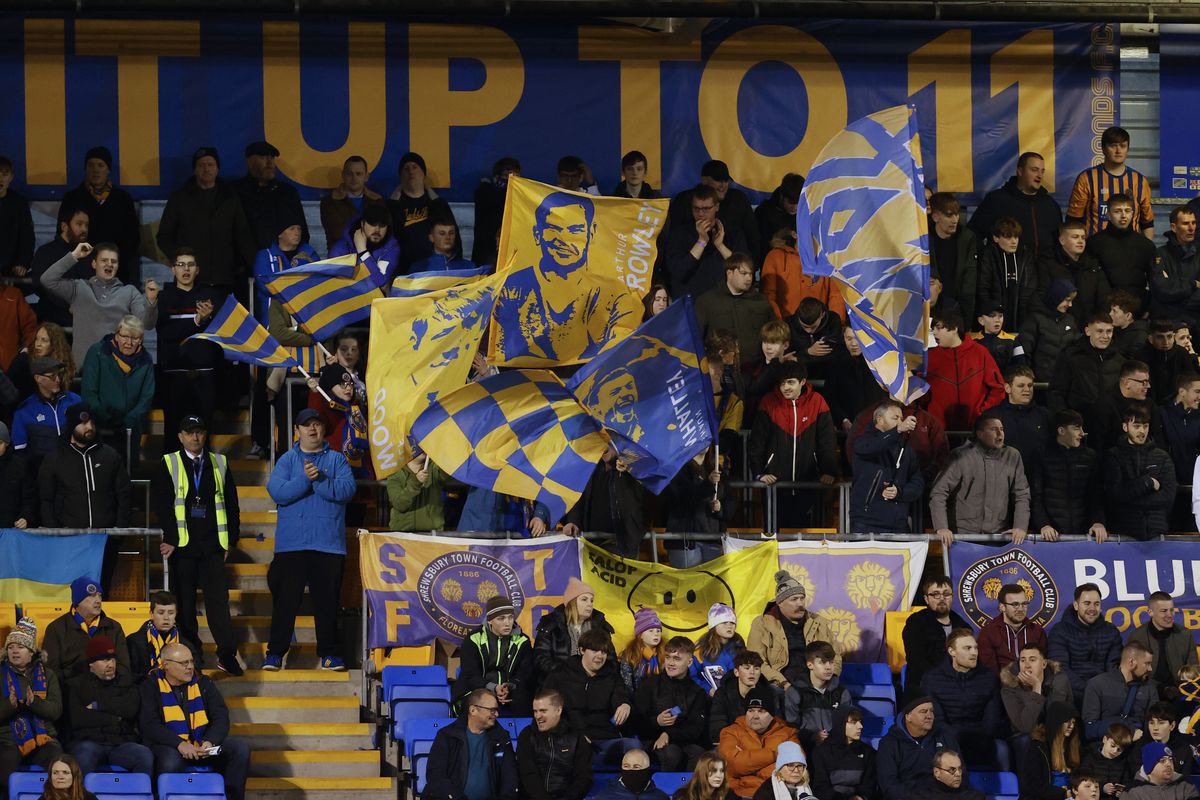 Some of the banners and flags set up by South Stand Flags in Shrewsbury's safe standing section (AMA)