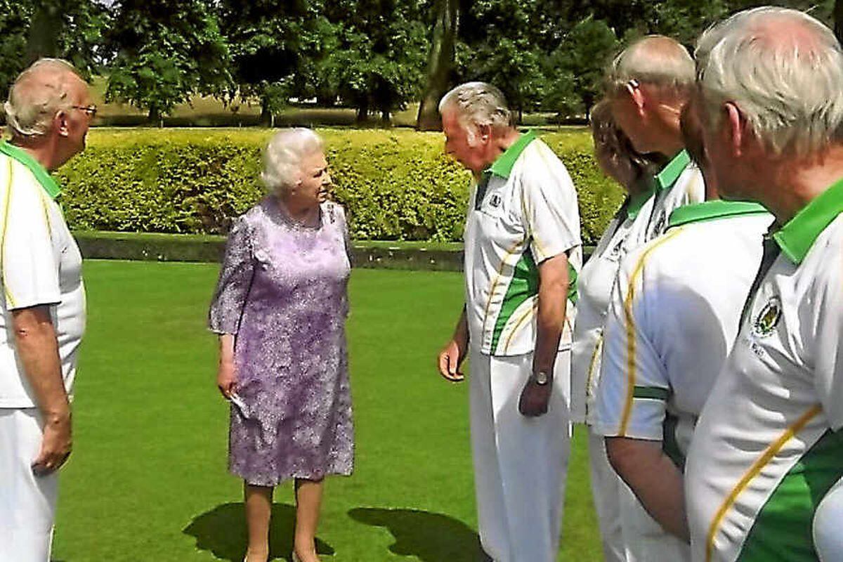 The Queen stops to chat with Brimfields Maurice Bassett and his team-mates