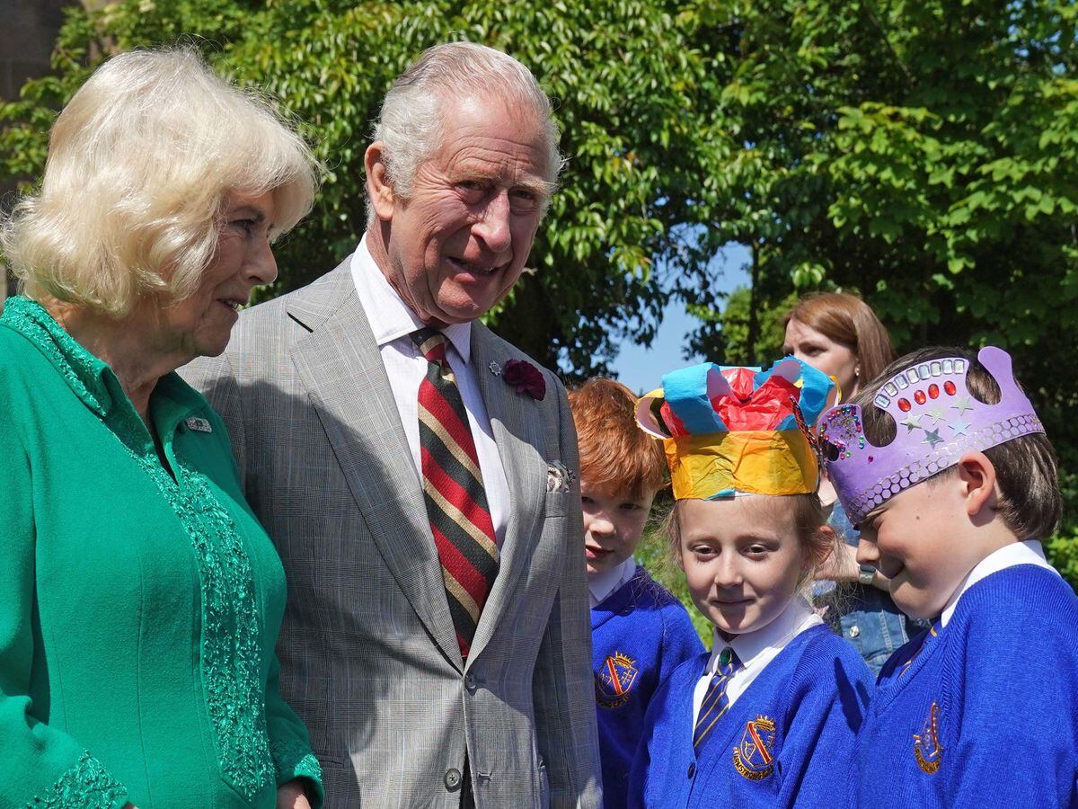 The King and Queen meeting Camilla Nowawakowska and Charles Murray, both aged eight, during their trip to Armagh