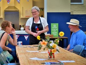 Lynn Howard from the Market cafe has a giggle with customers