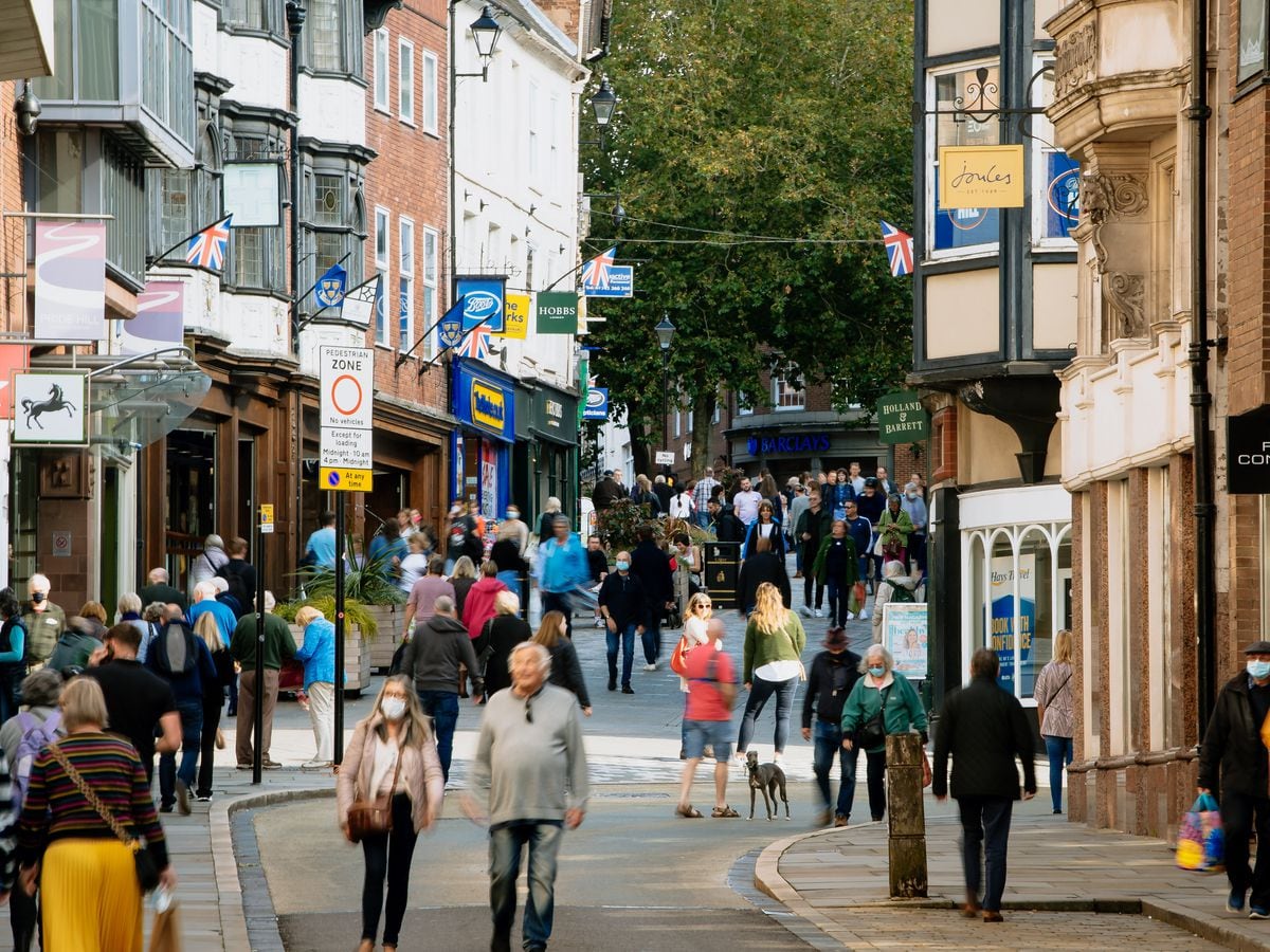 Pedestrians on the corner of Shoplatch and High Street in Shrewsbury