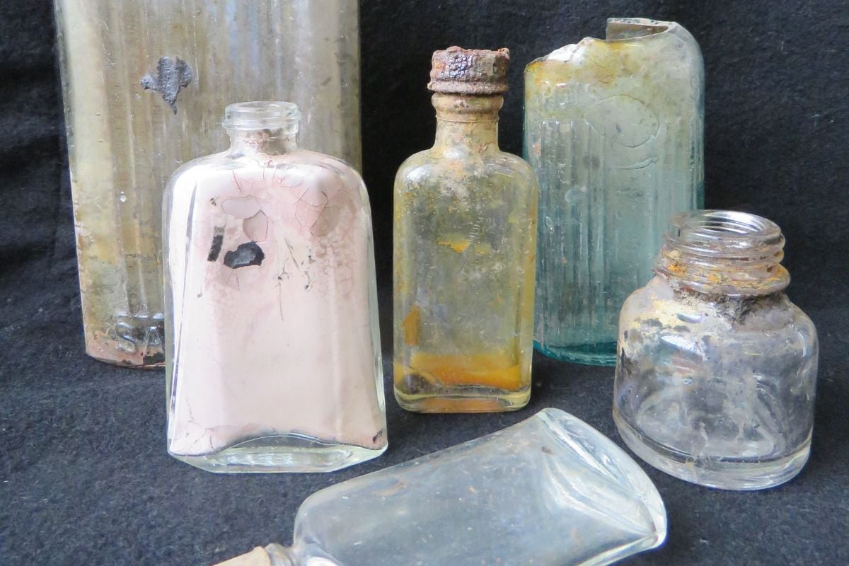 Glass bottles once containing hygiene and cleaning products. Photo: Wessex Archaeology