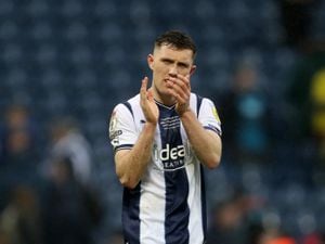 West Brom captain Dara O'Shea applauds the fans after victory over Huddersfield (Photo by Adam Fradgley/West Bromwich Albion FC via Getty Images).