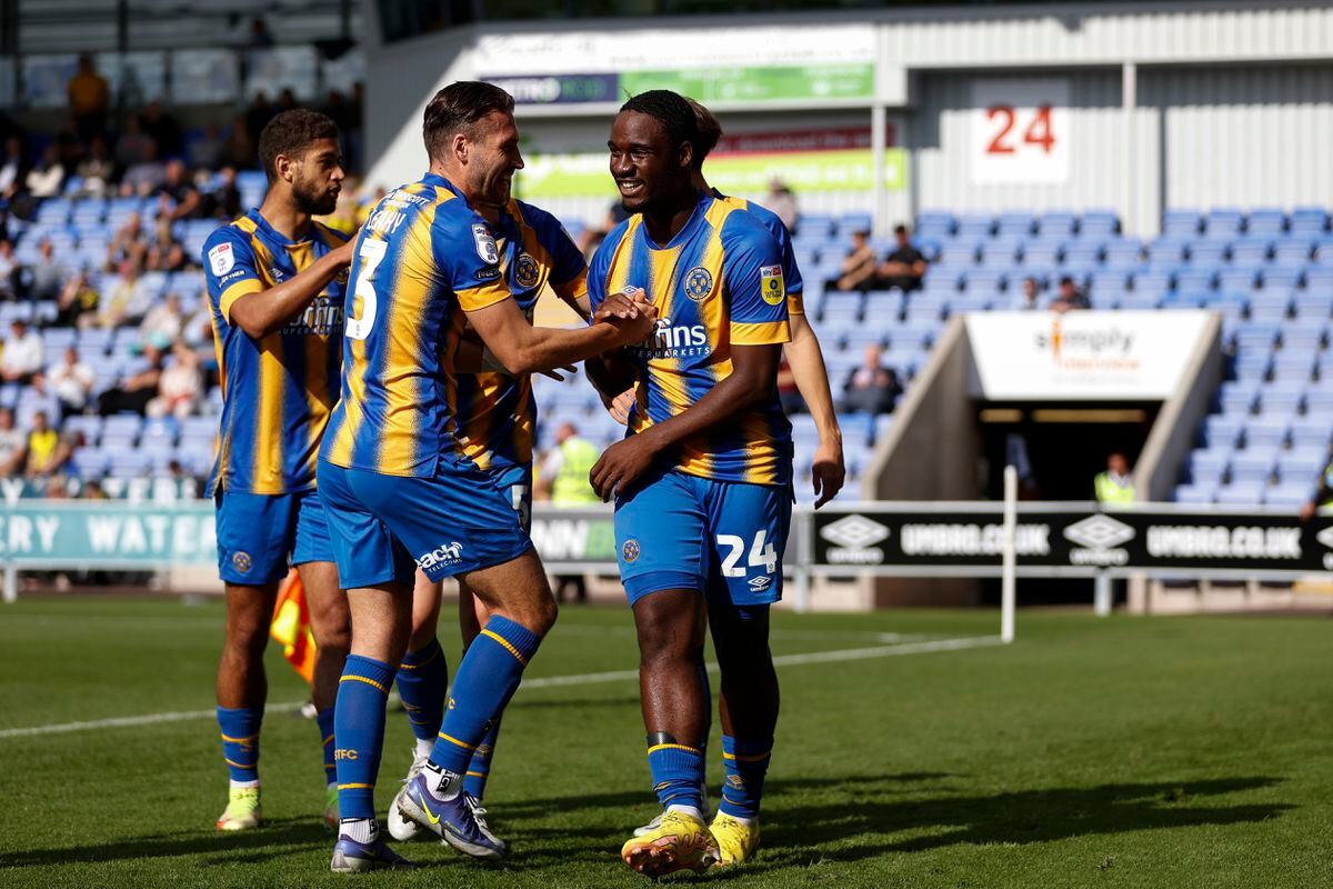 Christian Saydee of Shrewsbury Town celebrates with his team mates after scoring a goal to make it 1-0 (AMA)