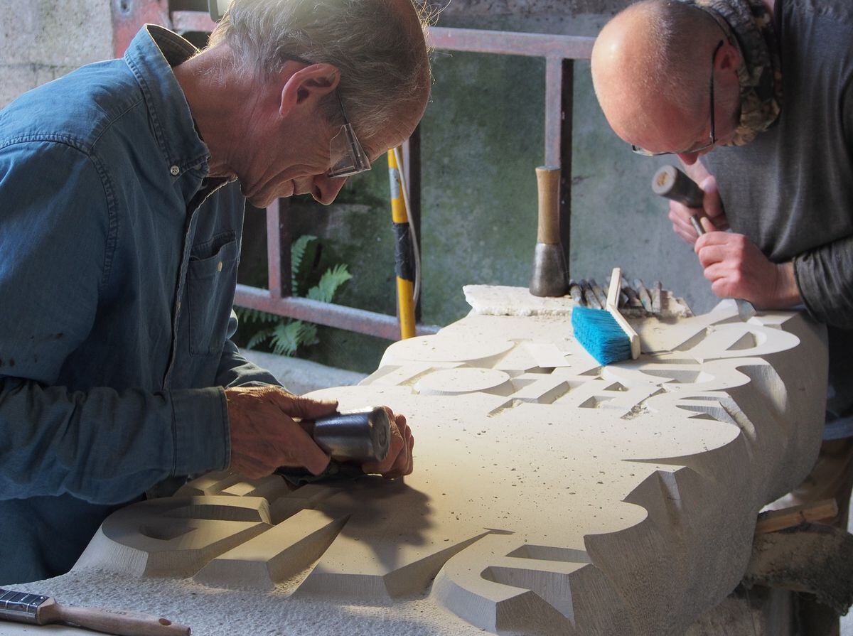 Artist John Neilson, assisted by Trevor Clarke, put the finishing touches to the stone carving for the Jebb Garden ( Picture: Bob Richards)
