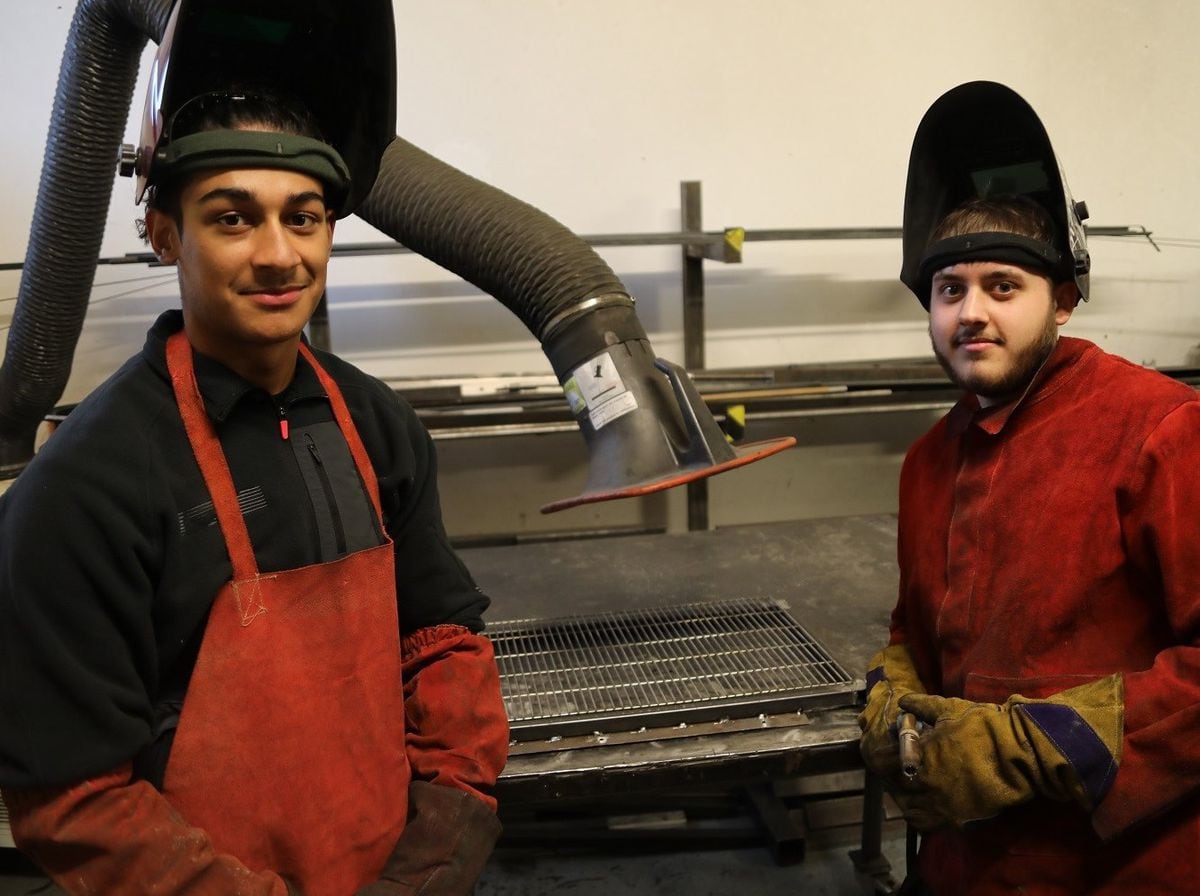 Mechatronics apprentices Rheon Paul, left, and Nathan Stubbs, at Sirane