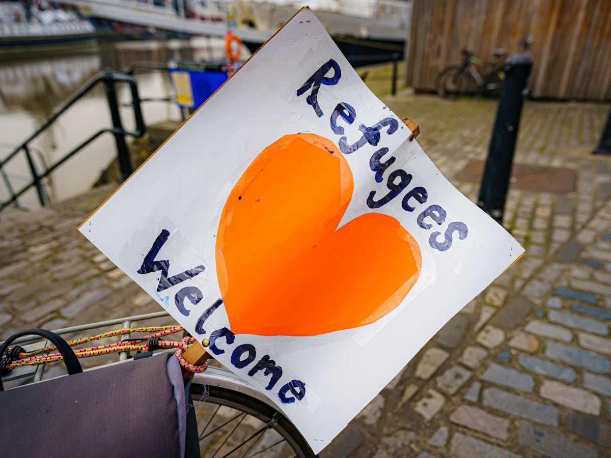 A ‘refugees welcome’ banner attached to a bicycle