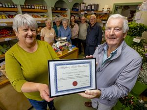 Cartwrights in Albrighton will close at the end of June. Pictured: Jayne Houghton and Mike Pitchford from Albrighton And District Civic Society with shop staff and civic society members