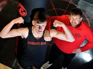 Josh Greer, 20, at Rigorous Gym in Welshpool with his trainer Warren Sinden.
