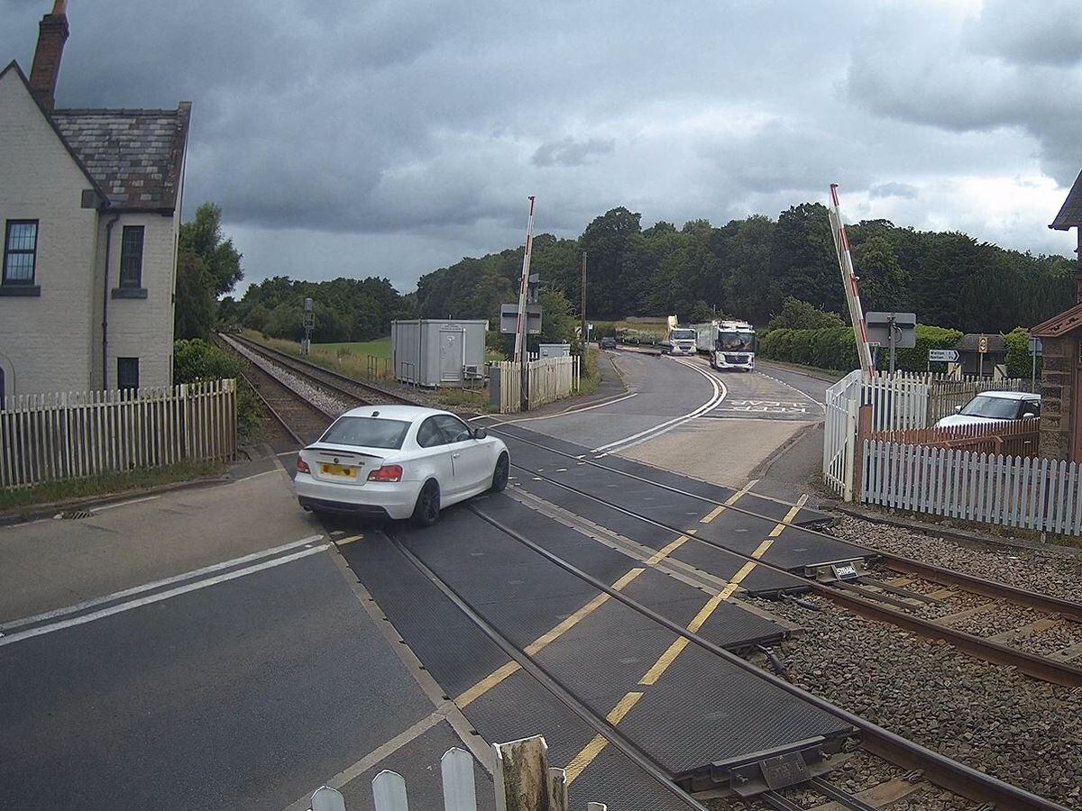 Video shows moment BMW driver charged over level crossing as barriers came down 