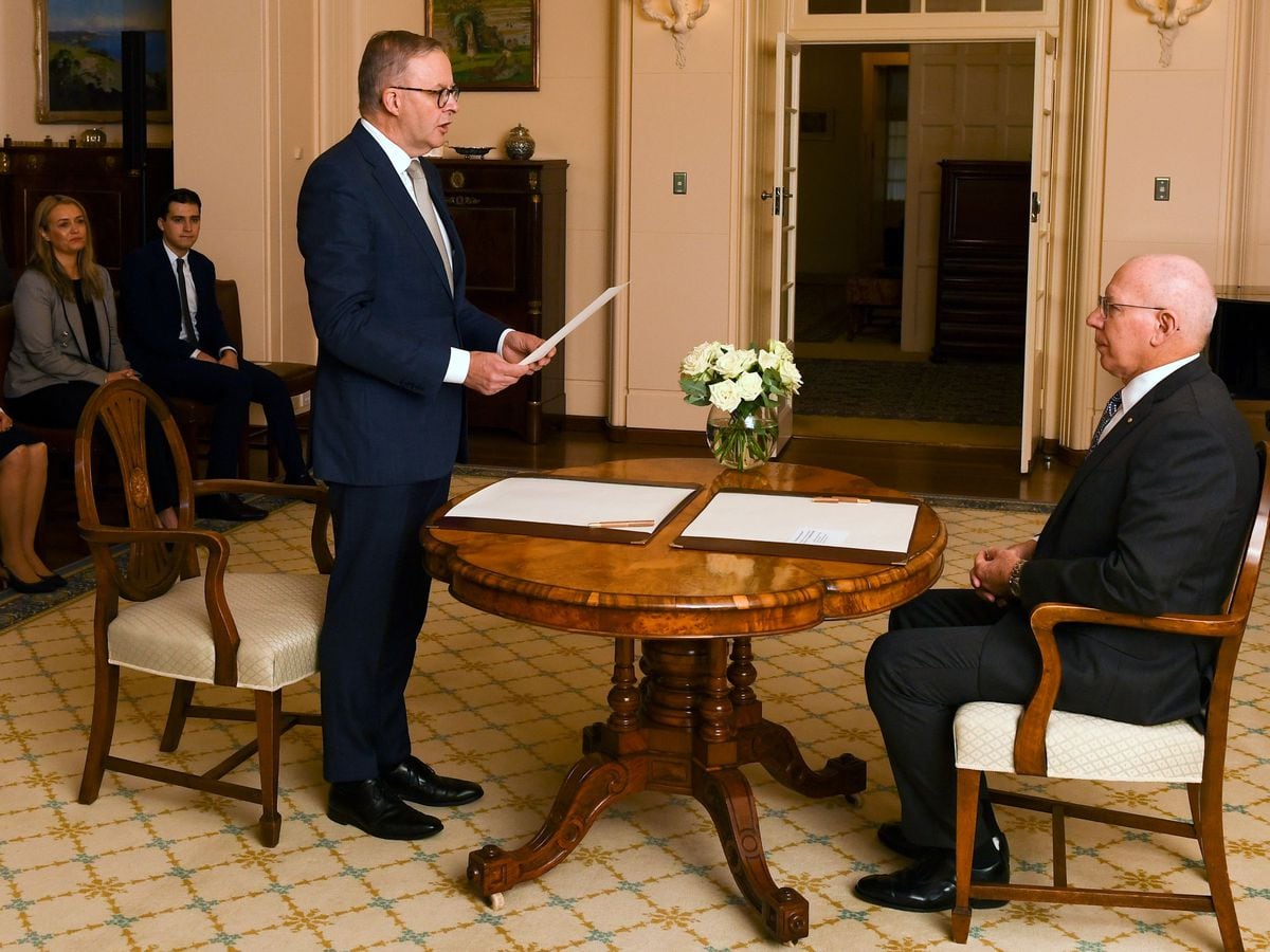 Anthony Albanese (left) is sworn in as Australia's Prime Minister by Australian Governor-General David Hurley