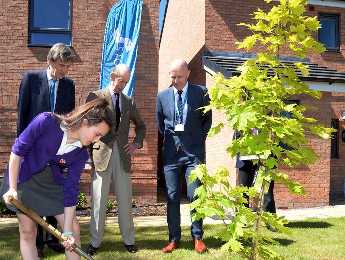 HRH the Duke of Kent planting a tree at the Noden’s Mews development as part of Stonewater’s commitment to plant five trees for each new home built, helped by Elise, a pupil from Leominster Primary School
