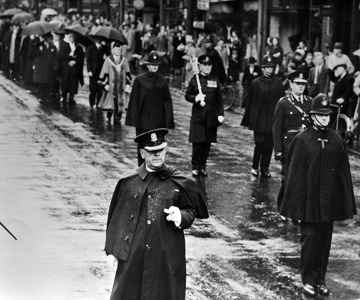 The Mayor of Wolverhampton, Councillor T.W. Phillipson, members of the council and Corporation officials walking to a thanksgiving service at Darlington Street Church in Wolverhampton on the morning of VJ Day.