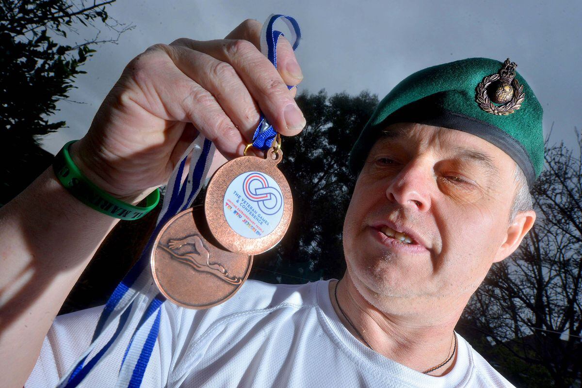 Nick Redshaw with his Veterans Games medals
