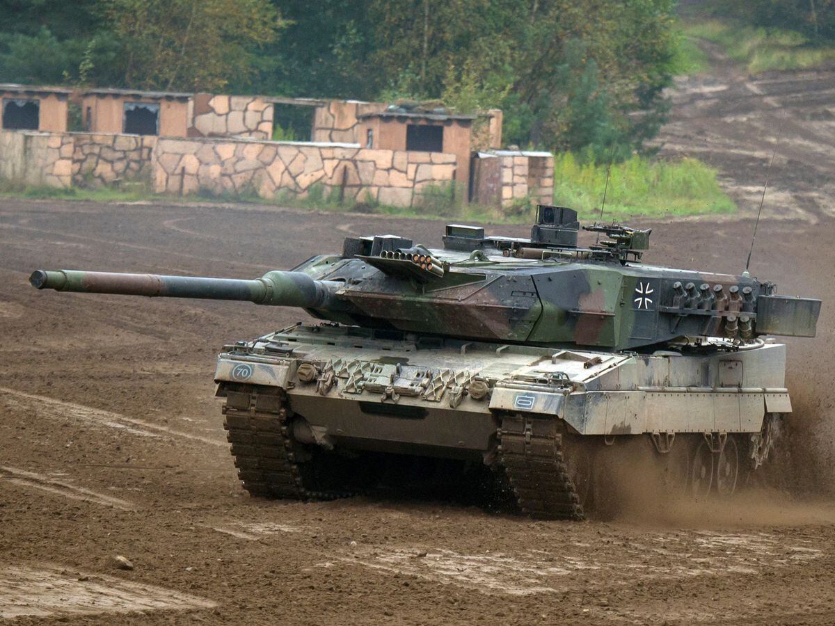 A Leopard 2A6 main battle tank drives across a training area in Munster, Germany