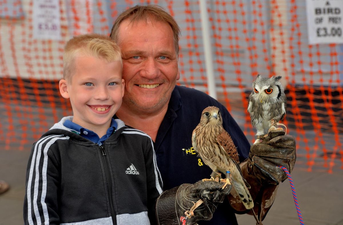 The Owl Man and son: Cody Perry, 8, and Carl Perry, from Wolverhampton,with Poppy and Fidget 