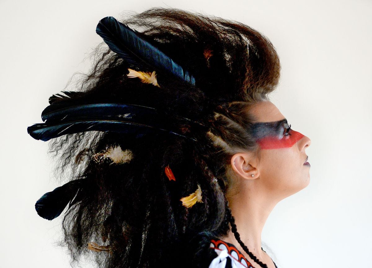 Laura Beech shows off her feathered mohican