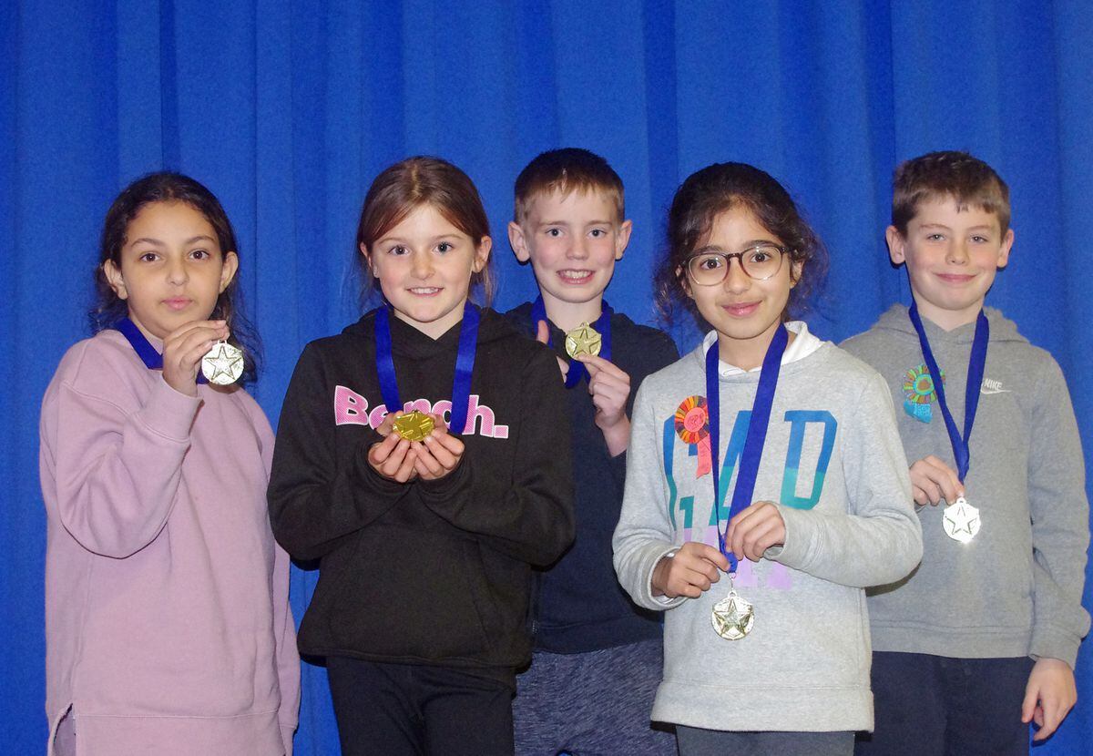 Lena, Lacey, Alfie, Aiza and Connor show off their medals