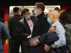 People wearing masks on the London Underground