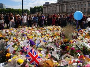 Flowers and tributes outside Buckingham Palace