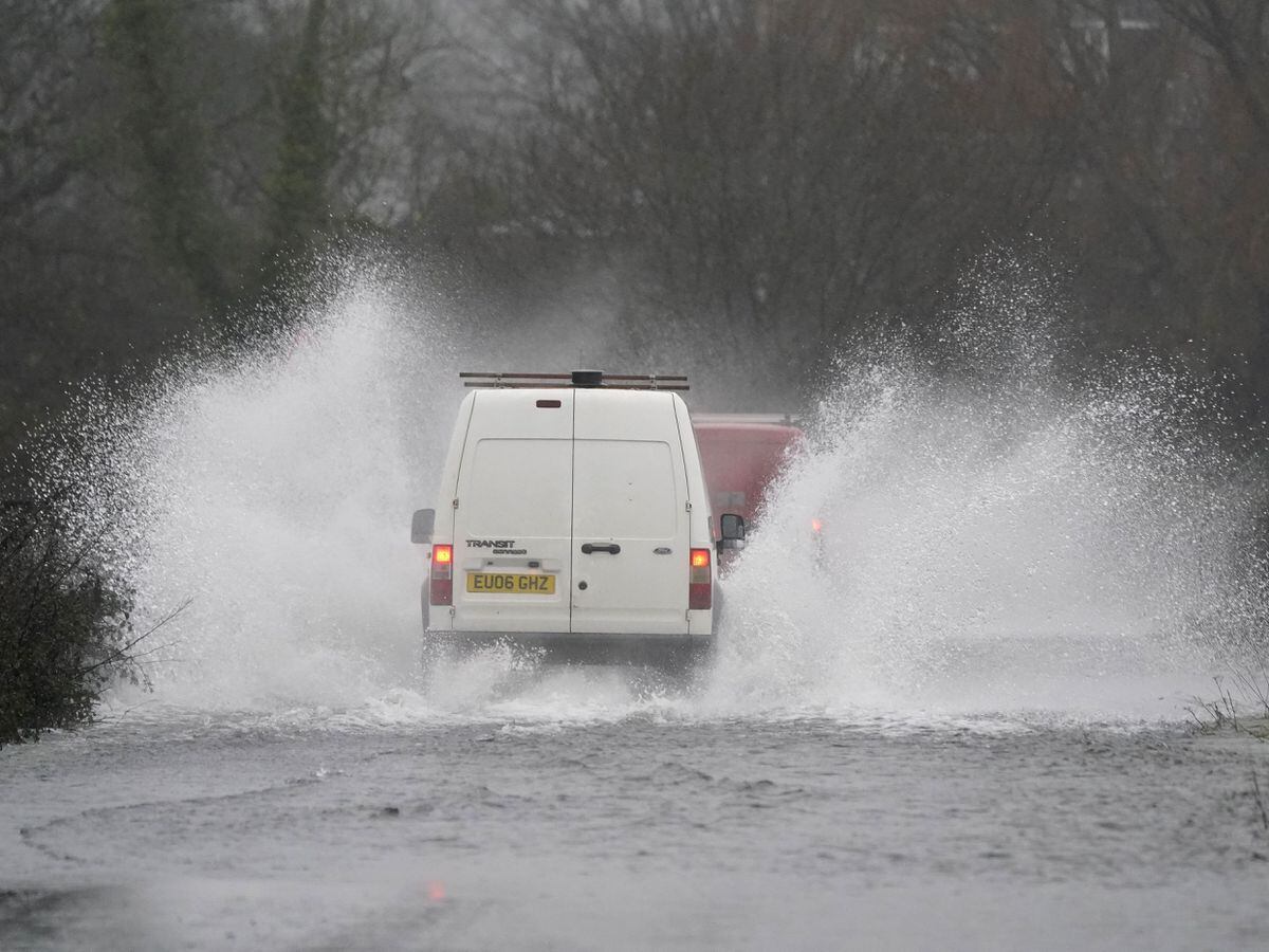 Van drives through flood