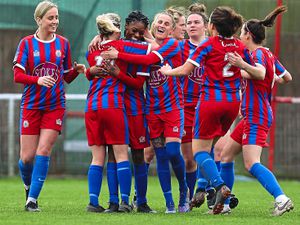 Kwahjay-Tabia Mapp (third left) is mobbed after scoring Wem Town’s fourth goal of the game       Pic: James Baylis