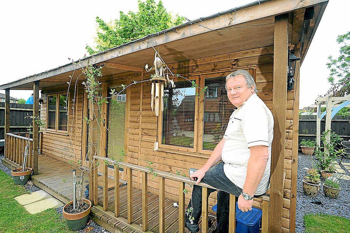 Wait until you see whats inside  Dave Evans takes a break outside his garden shed  Cue Gardens  in?Telford 
