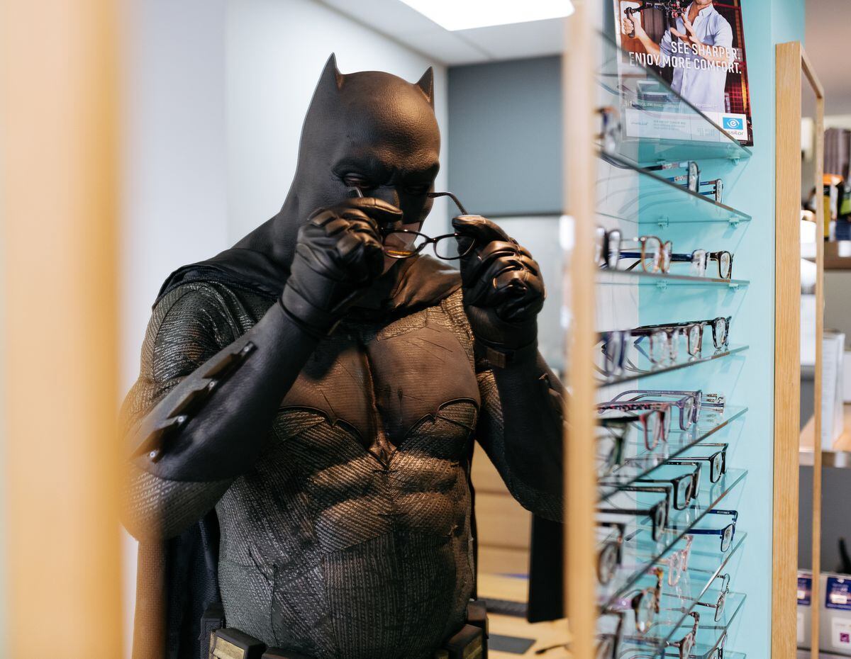 Blind as a bat? Batman tries on a new pair of specs