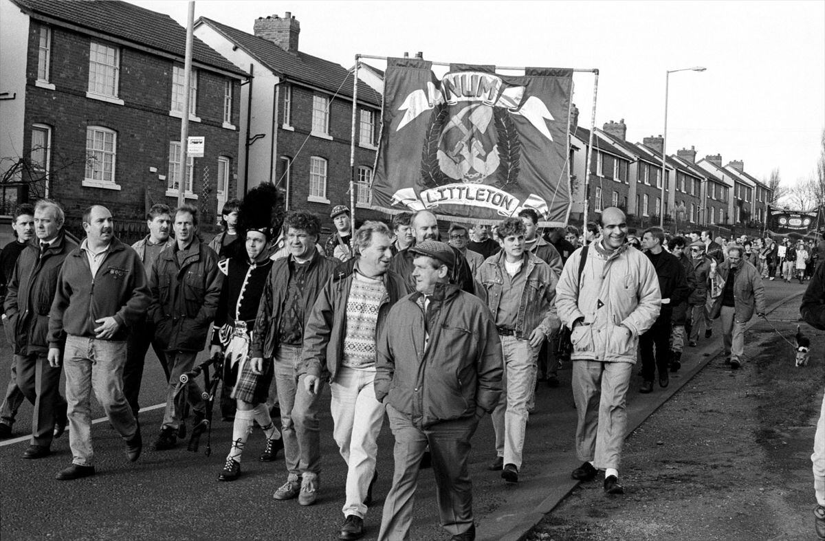 Miners marching away from Littleton Colliery, after the last shift in December 1993. Malc Armishaw can be seen third in from the left, with Jimmy Perry standing to the right of the Piper, and Alan Owenstanding next to him. Malc Wakeman is in the foreground, with Nemit Hulla on the far right of the second row.