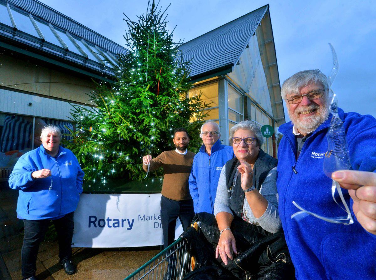 Market Drayton Rotary Club's Tree of Lights where people will be able to add icicle decorations to it. L-R: Janey Manton , Store Manager: Hamel Purohit, Alan Cartwright, Dianne Spellar (Store Community Champion), Bill Manton..